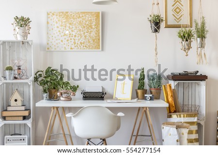 Well-lighted room interior with gold design