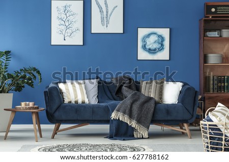 Spacious blue living room designed in old style