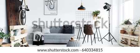 Panorama of minimalist apartment for man with hipster furniture