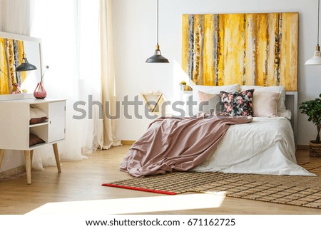 Nice and stylish bedroom in warm colors