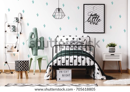 Pattern stool on wood floor and accessories on white ladder in kids bedroom with cute wallpaper