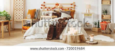 Autumn style in cozy bedroom with wood decoration