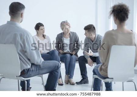 Man talking to a psychotherapist about family problems during meeting with support group