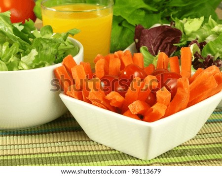 Carrot sticks, lettuce and orange juice for your diet