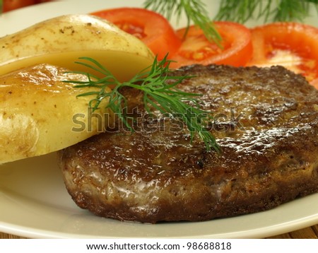 Grilled meat with potatoes and tomatoes