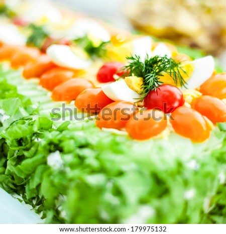 Sandwich cake with tomatoes and salad
