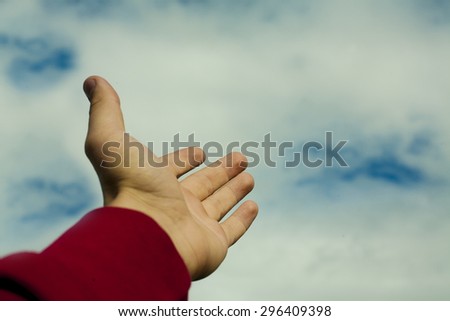 hand pointing to the sky