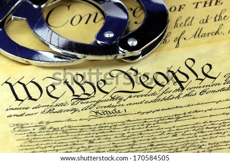 Handcuffs on US Constitution We the People - Fourth Amendment