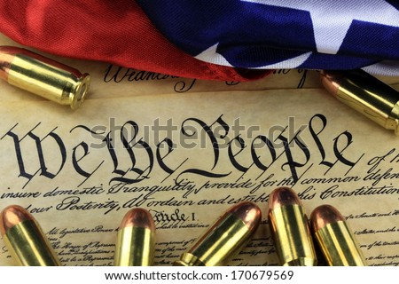 US Constitution Bill of Rights with 45 caliber bullets and American flag