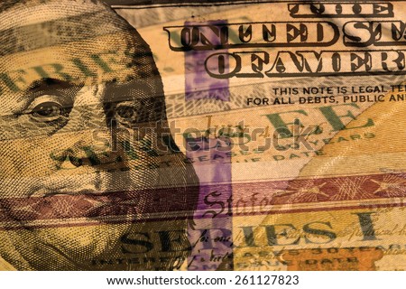 Double exposure one hundred dollar bill and US treasury savings bond - Finance and government concept
