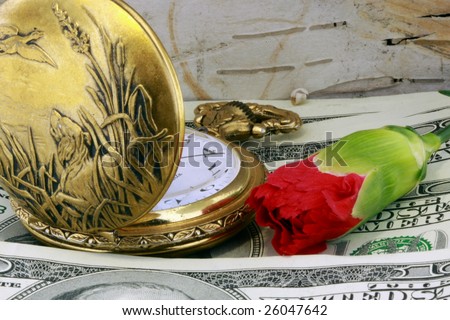 time and money concept - pocket watch, flower and one hundred dollar bills