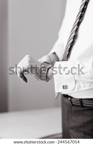 Man wears watches. Preparation for an important event