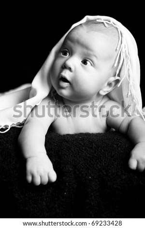 Little kid on a plain background. Black and white photo
