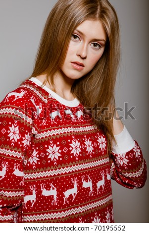 Woman to the waist with big eyes in a sweater