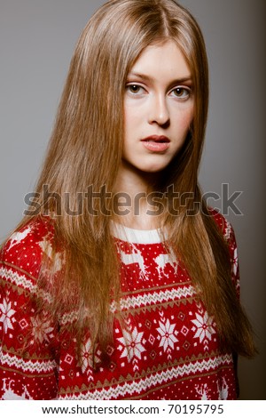 Portrait of woman with big eyes in a sweater
