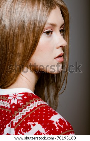Portrait of woman with big eyes in a sweater