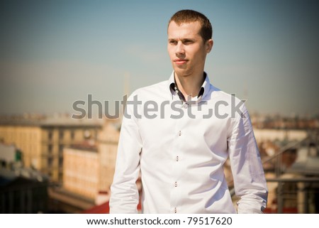 man in the shirt of the summer terrace on the roof