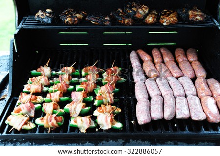 fresh meat grilling with sausage, chicken and bacon
