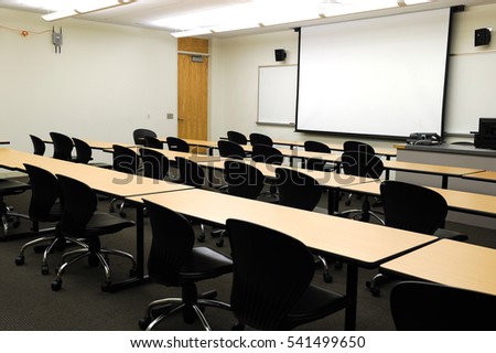 close up on classroom, seat, table and projector screen