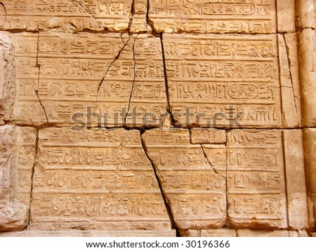 stock-photo-antique-egyptian-hieroglyphics-on-stone-wall-in-karnak-temple-luxor-egypt-30196366.jpg