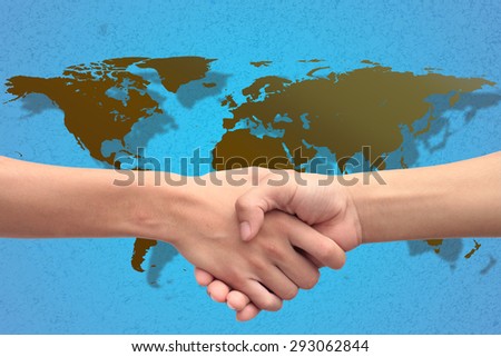 handshake of success congratulation greeting dealing with world map background. design with space for adding text.