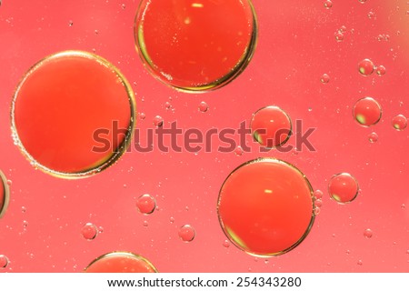 Oil and water abstract in grungy pink and red
