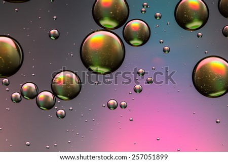 Pink, purple and gold oil and water abstract background