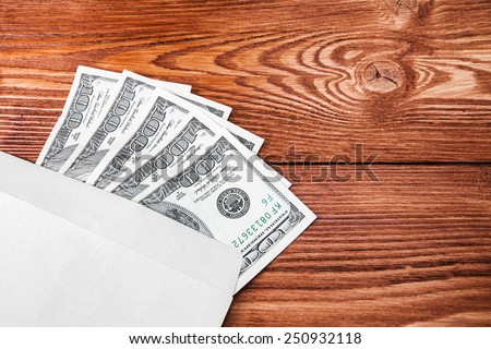five hundred dollars out of one hundred dollar bills in an envelope