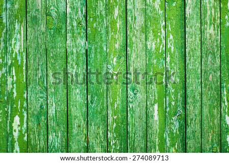 Wooden Palisade background. Close up of green wooden fence panels. Vintage wood background. Old wooden fence. Wood texture background. wood fence background