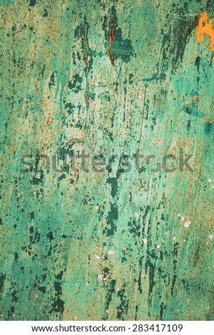 Rusty metal textured background with a light cracked paint