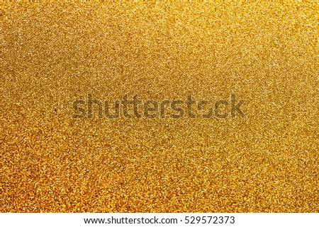 Golden glitter background with little sparkles. Festive backdrop fot your text or design.