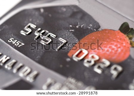 Fragment of a plastic credit card on a white background