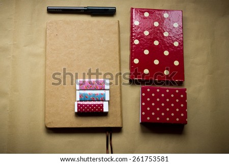Notebooks set, pen, erasers, stickers.Polka dots pattern. with shallow depth of field.