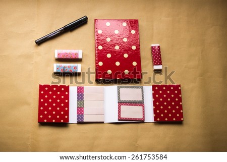 Notebook pen, erasers, stickers.Polka dots pattern. with shallow depth of field.