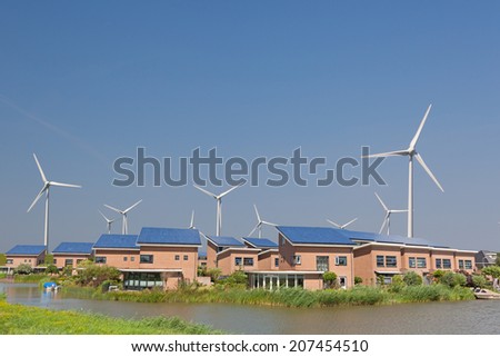 New family homes with solar panels and wind turbines