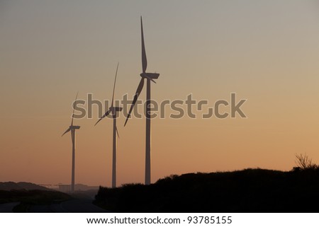 Silhouette of Windfarm during sunset