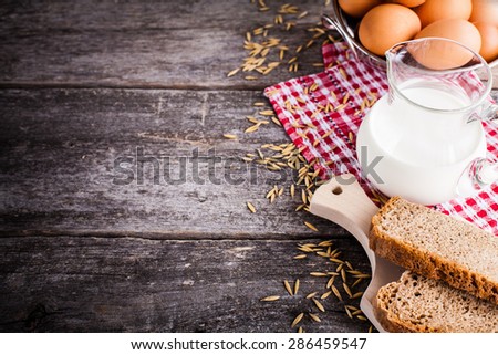 eggs milk bread on the wooden background