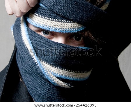 Covered Face with Blue Eyes