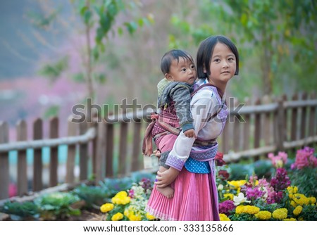 Woman from Black Hmong Hill Tribe, children girl smile,Thailand