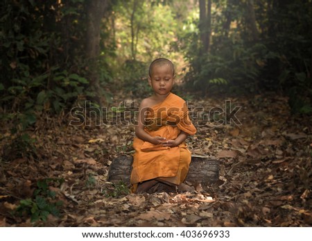 Novice meditating for young buddhist novice monk