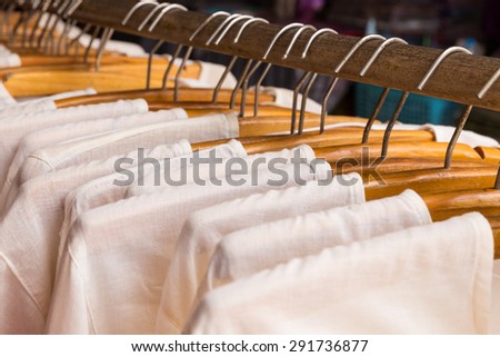 White clothes on wooden hangers