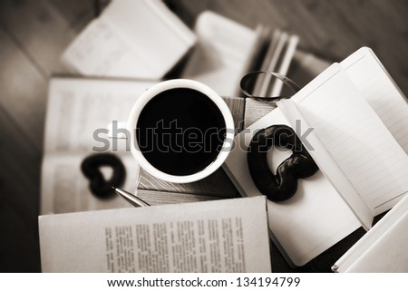 image of cup of coffee, books, cake, monochrome