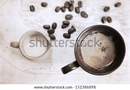 artwork  in grunge style,  two cups of coffee, milk jug, coffee beans, world political map
