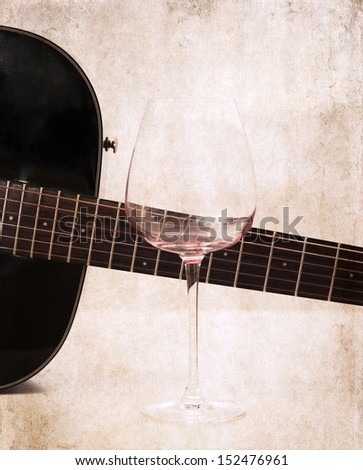 artwork  in grunge style,  acoustic guitar and empty glass of wine