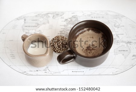 artwork  in grunge style,  two cups of coffee, milk jug, cookie,  world political map