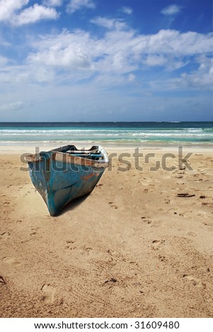 Old boat on beach of Punta Cana, Dominican Republic