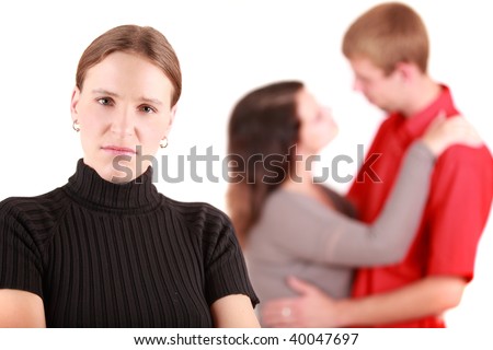 stock photo : Portrait of jealousy girl with lovers in background, studio shot