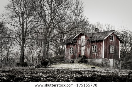 Old run down, ramshackle farm house in muted tones