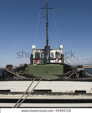 An old wooden fishing trawler ready to go to sea.