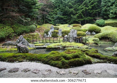 Peaceful Japanese Zen Garden with Pond, Rocks, Gravel and Moss